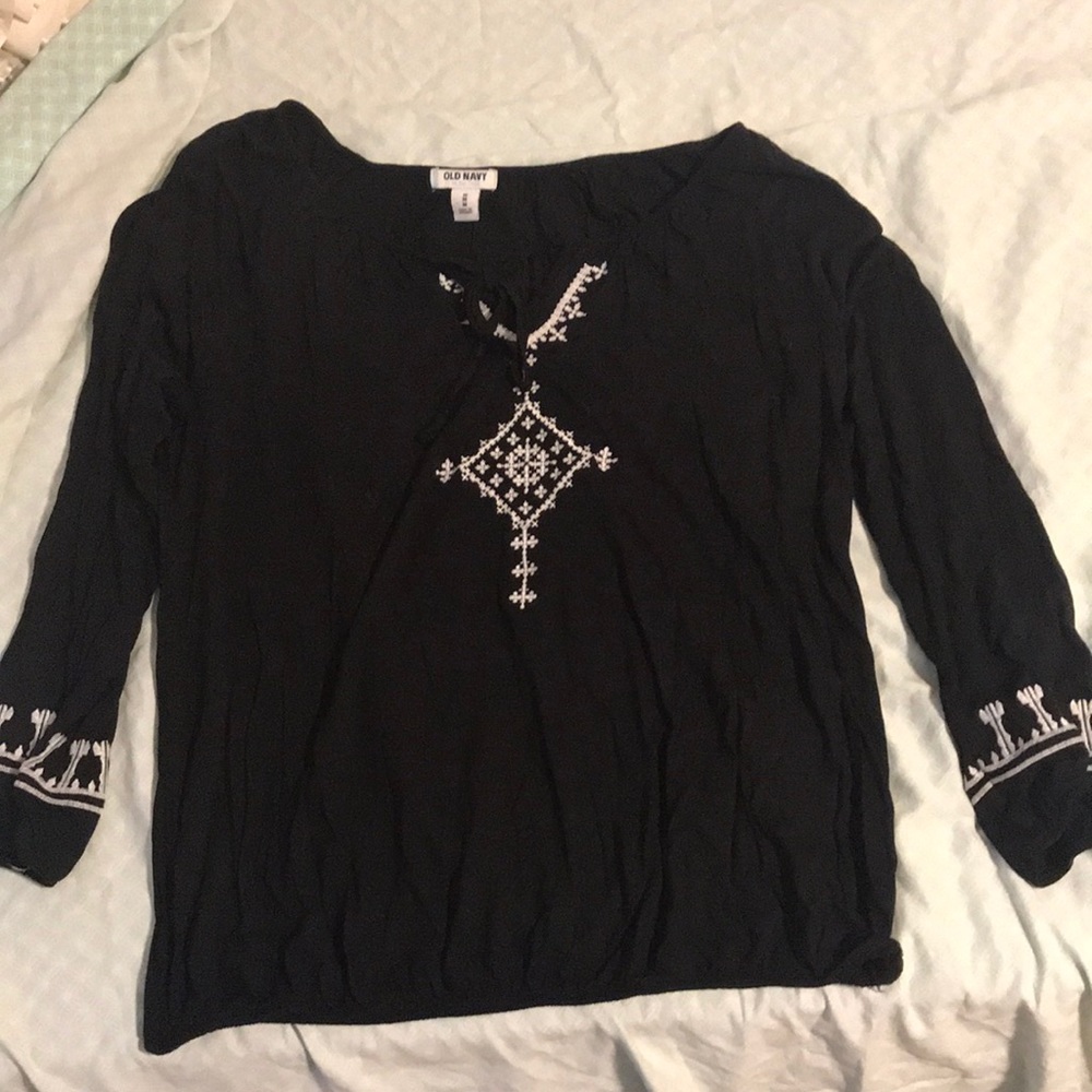 Black with white tribal print embroidered.